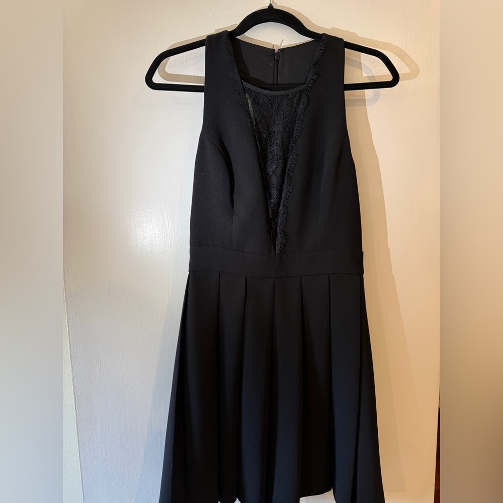 BCBGenerstion Elegant Black Sleeveless Dress with lace trimming